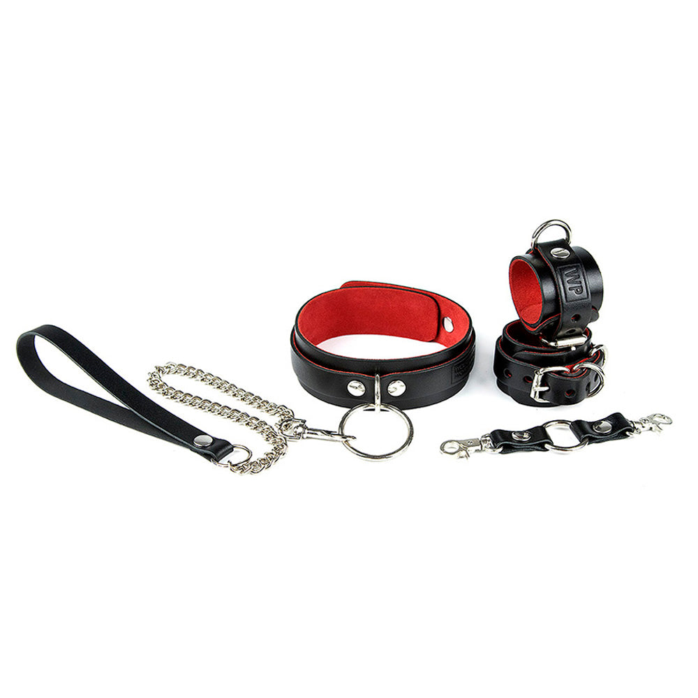 Black leather bondage set on red suede lining