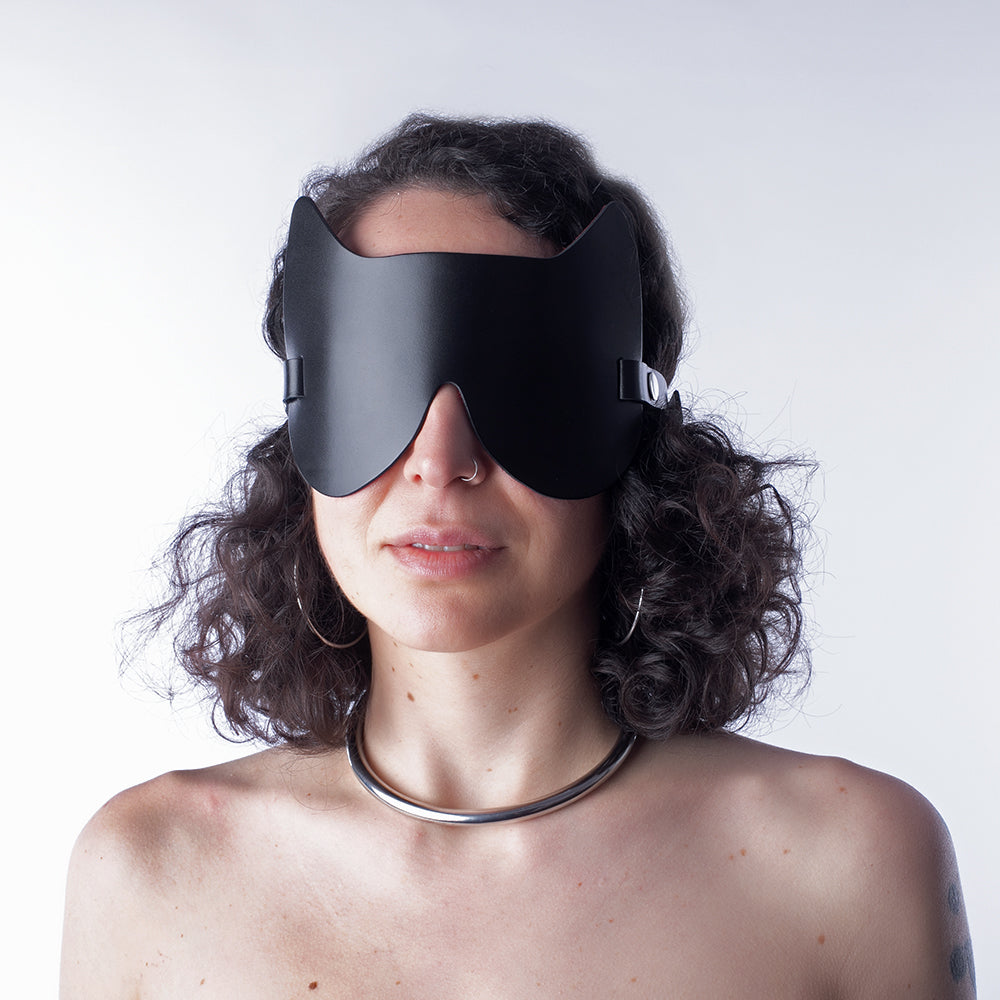 Women wears black sensory deprivation mask